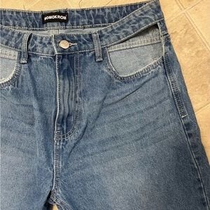 Unique jeans with cut out front pockets